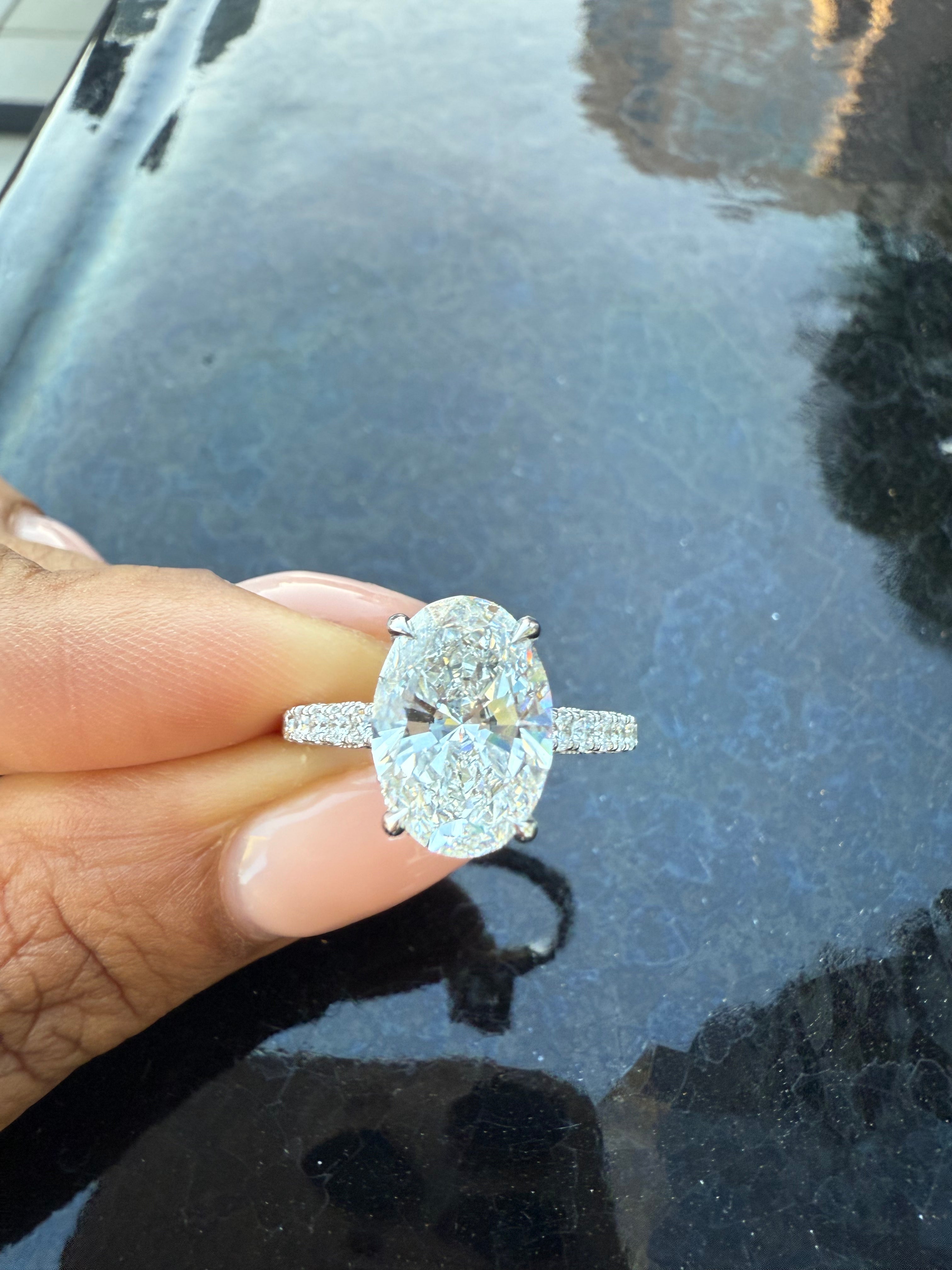 Oval Diamond Engagement Ring with Side Stones