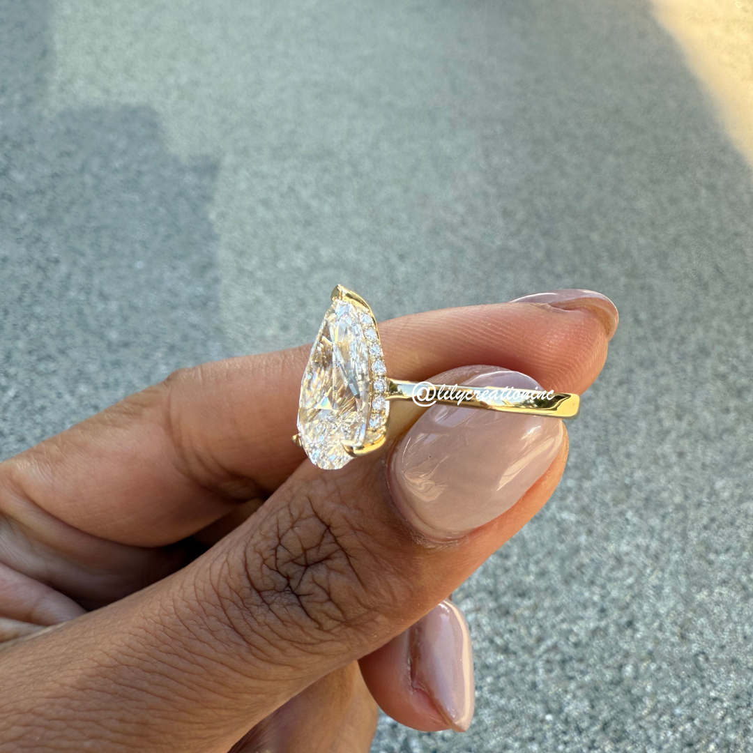 Three-Prong Pear Cut Diamond Engagement Ring With Hidden Halo