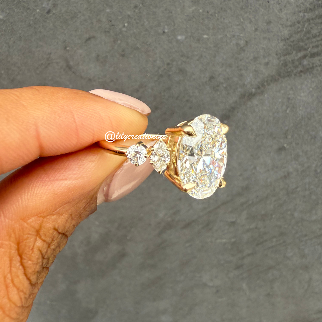 Oval Diamond Engagement Ring With Marquee & Round Side Stones