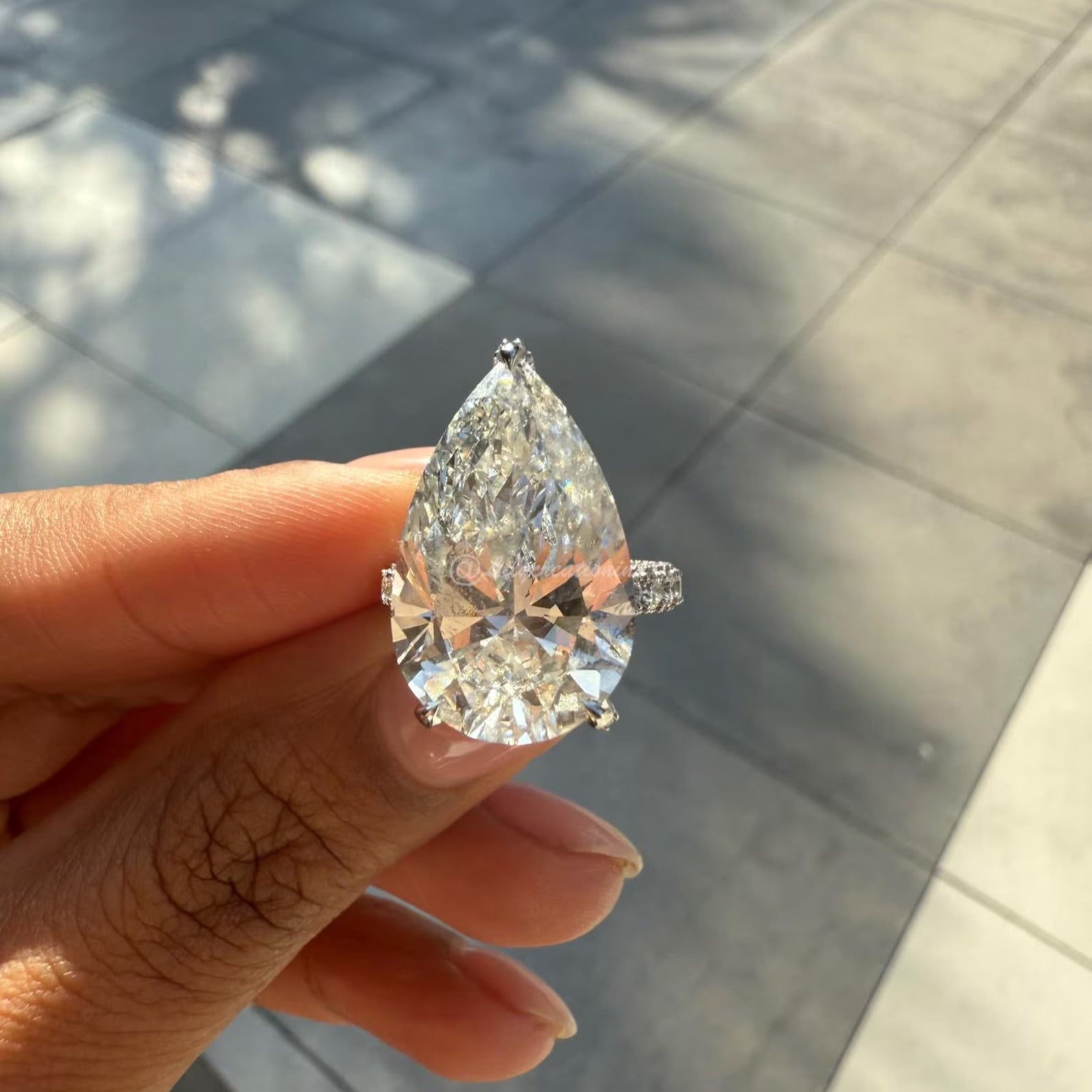 Three-Prong Pear Cut Diamond Engagement Ring With Sid Stones