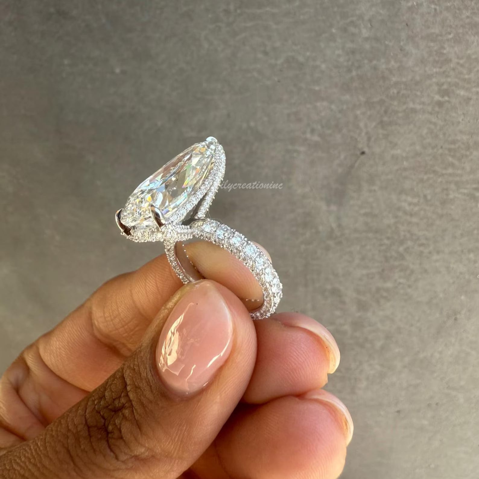 Three-Prong Pear Cut Diamond Engagement Ring With Sid Stones