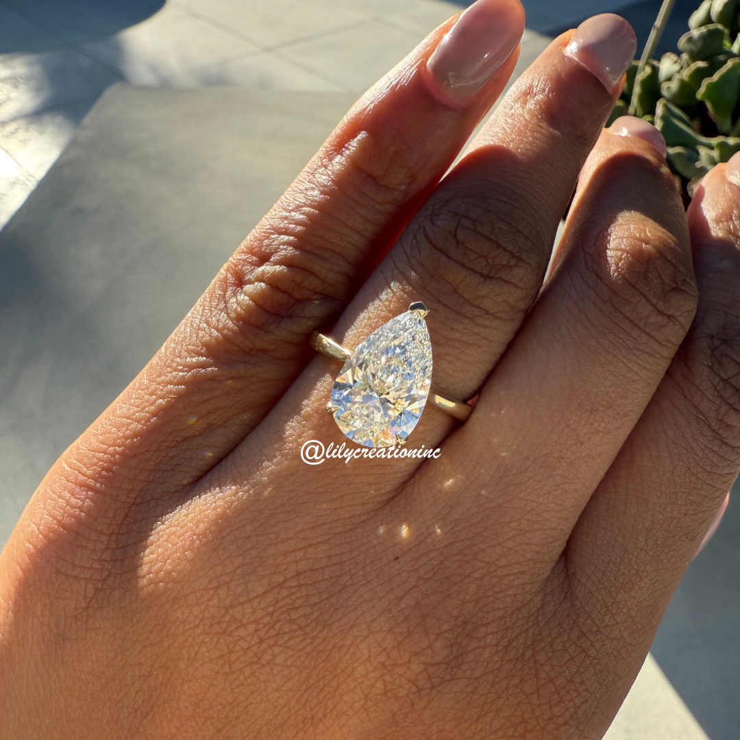 Three-Prong Pear Cut Diamond Engagement Ring With Hidden Halo