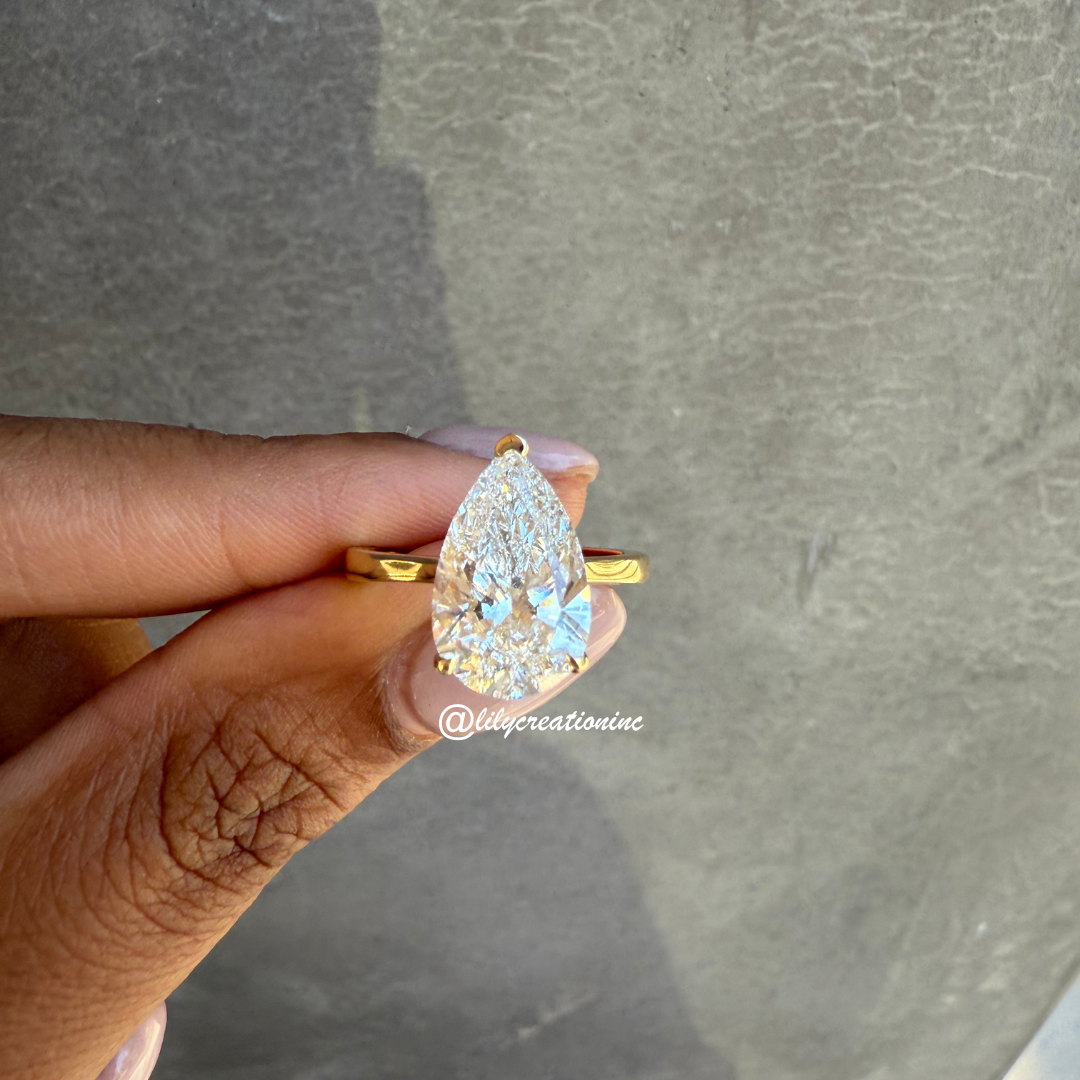 Three-Prong Pear Cut Diamond Engagement Ring With Hidden Halo