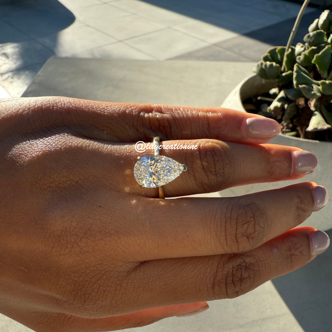 Three-Prong Pear Cut Diamond Engagement Ring With Hidden Halo