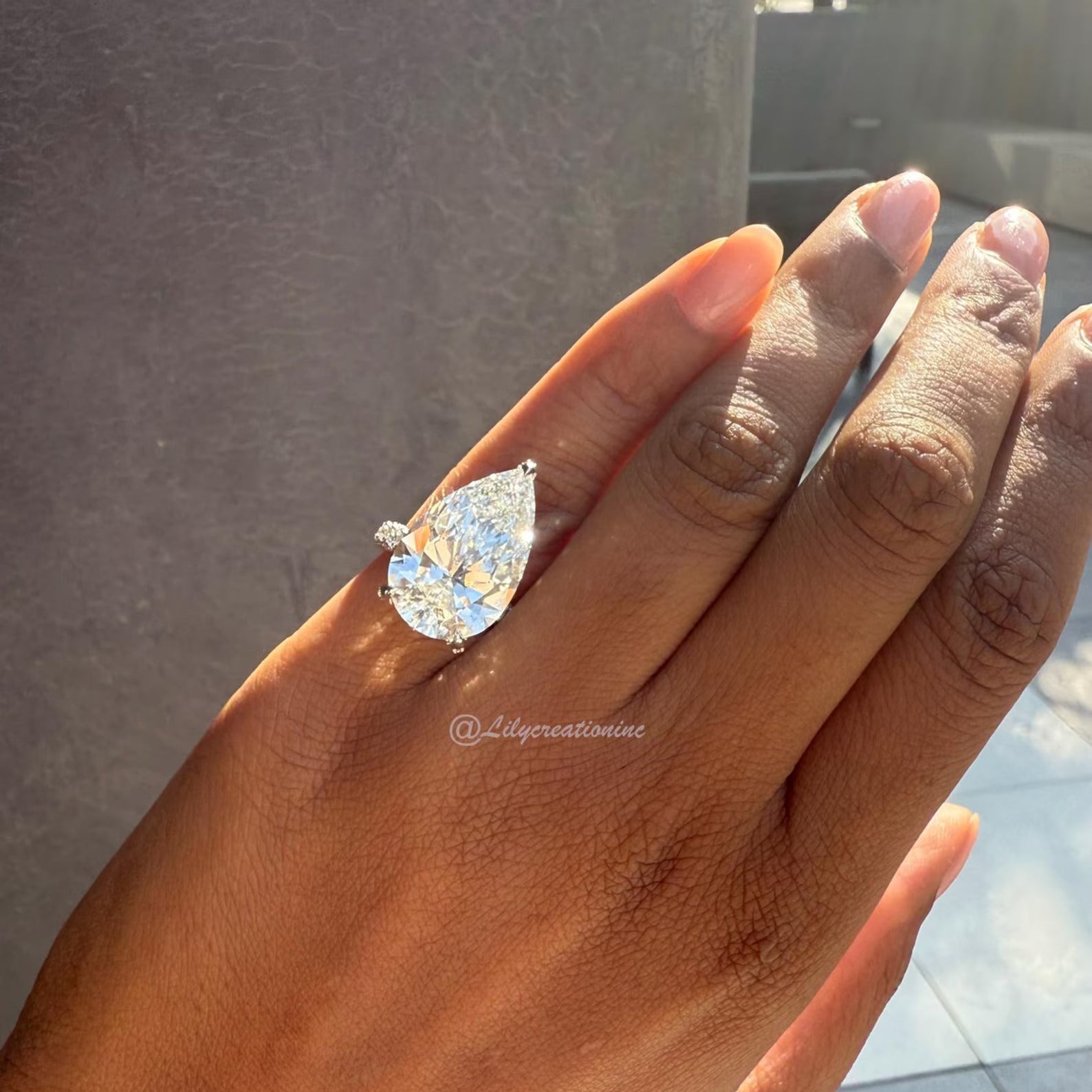 Three-Prong Pear Cut Diamond Engagement Ring With Sid Stones