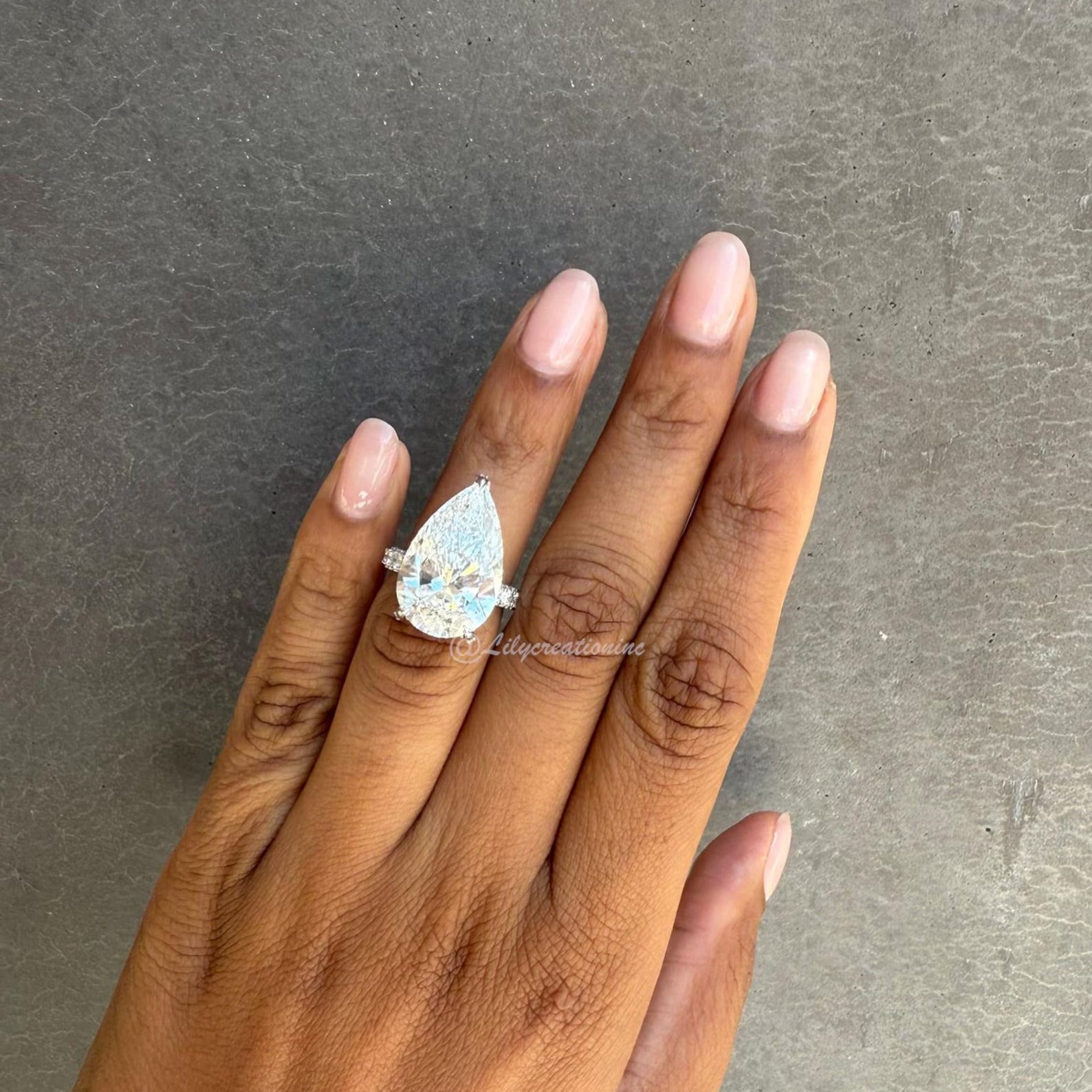 Three-Prong Pear Cut Diamond Engagement Ring With Sid Stones