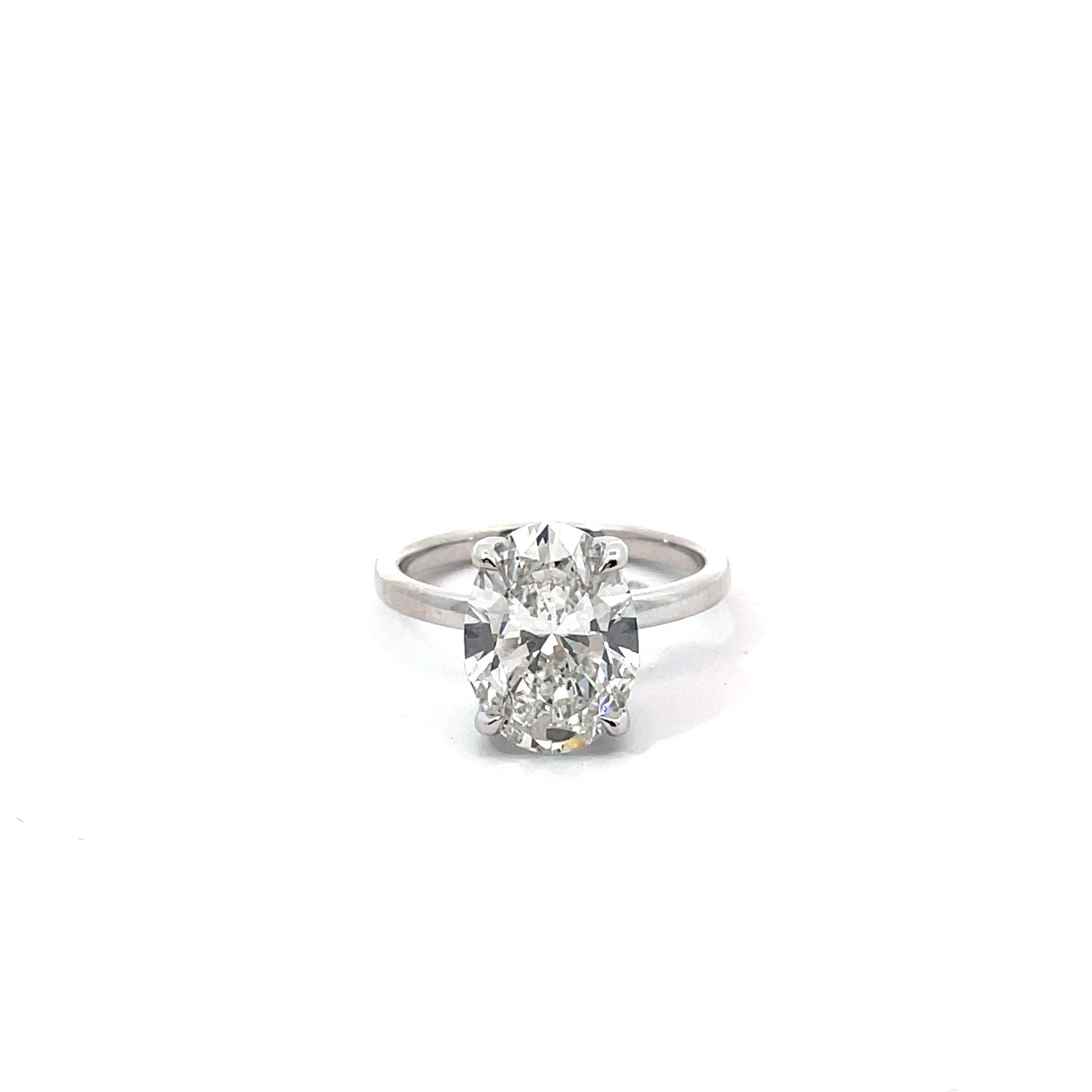 Oval hidden halo Diamond Engagement Ring